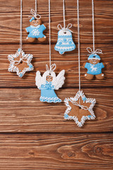 Christmas gingerbread cookies hanging on a wooden. vertical