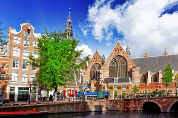 Fototapeta premium Amsterdam and typical houses with clear summer sky.Netherlands
