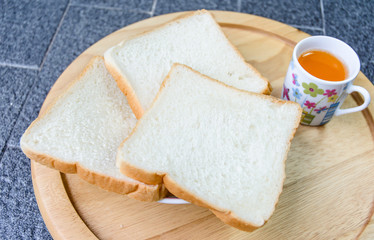 bread cut and orange drink