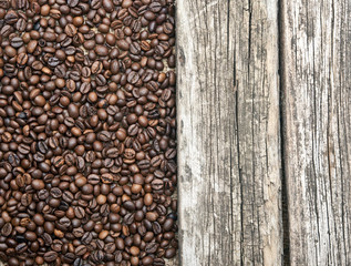 Coffee beans border old wood background