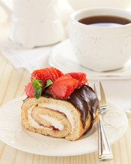 Chocolate swiss roll cake with strawberries