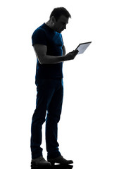 man holding watching  digital tablet  silhouette