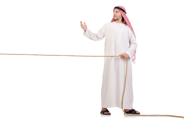 Arab in tug of war concept on white