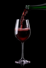 Wine being poured into a glass