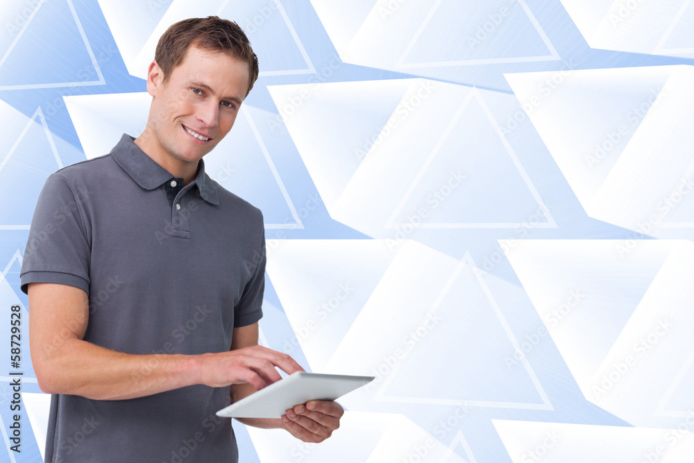 Poster Composite image of smiling young man with tablet computer