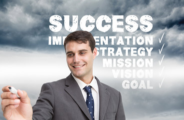 Composite image of young businessman writing something