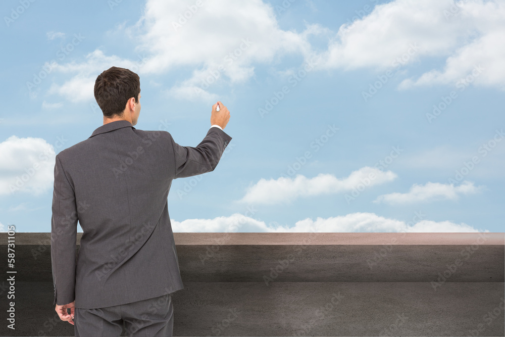 Poster composite image of businessman standing back to camera writing w
