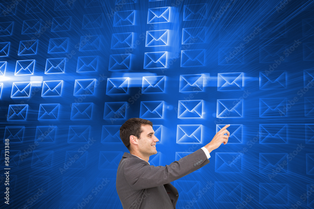 Poster Composite image of smiling classy businessman sitting and pointi