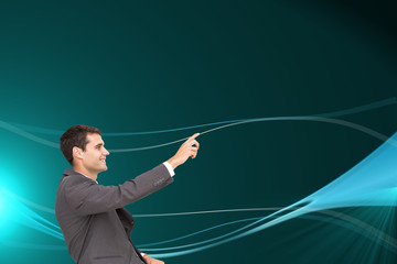 Composite image of smiling classy businessman sitting and pointi