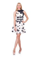 Tall model dressed in dress with polka dosts on white