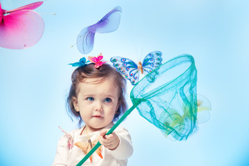 Toddler catching butterflies
