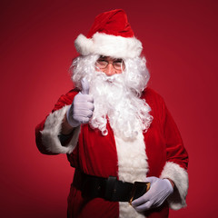 santa claus is making the ok thumbs up ok sign
