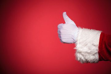 Santa Claus hand showing thumbs up ok sign