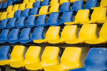 Naklejka premium Stadium seat close up, yellow and blue