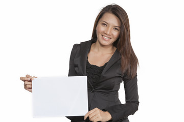 Young businesswoman attractive brunetee showing blank signboard
