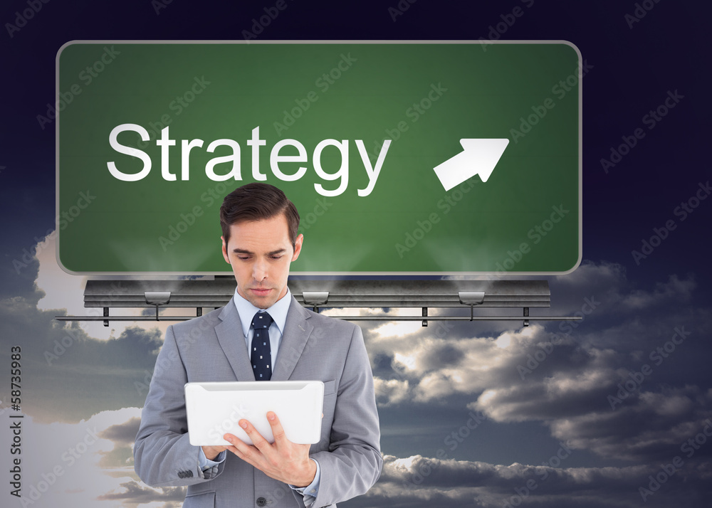 Poster composite image of businessman holding a tablet computer
