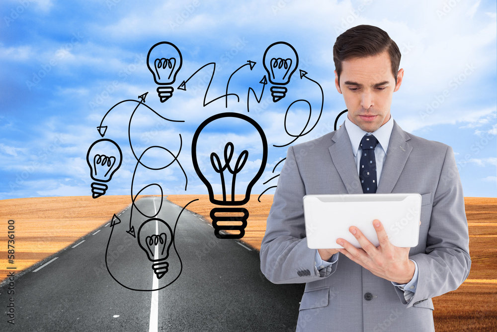 Poster composite image of businessman holding a tablet computer