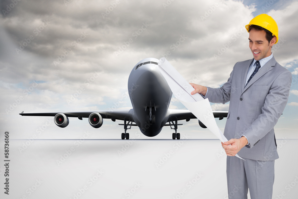 Poster Composite image of smiling architect with hard hat looking at pl