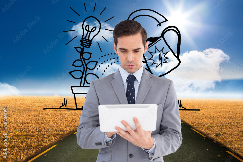Poster composite image of businessman holding a tablet computer