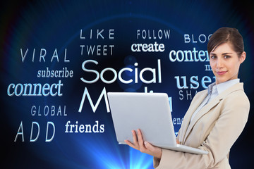 Composite image of confident young businesswoman with laptop