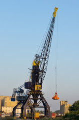 Fototapeta na wymiar Large gantry and cranes at river port