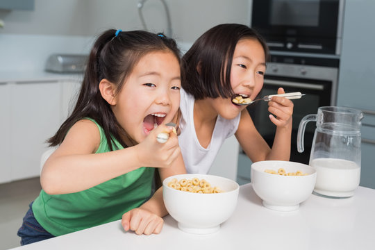 group of kids eating cereal