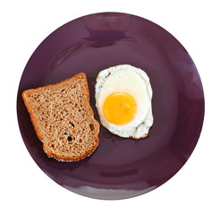 top view of fried egg and toasted rye bread