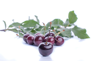 Sweet ripe cherry with leaf