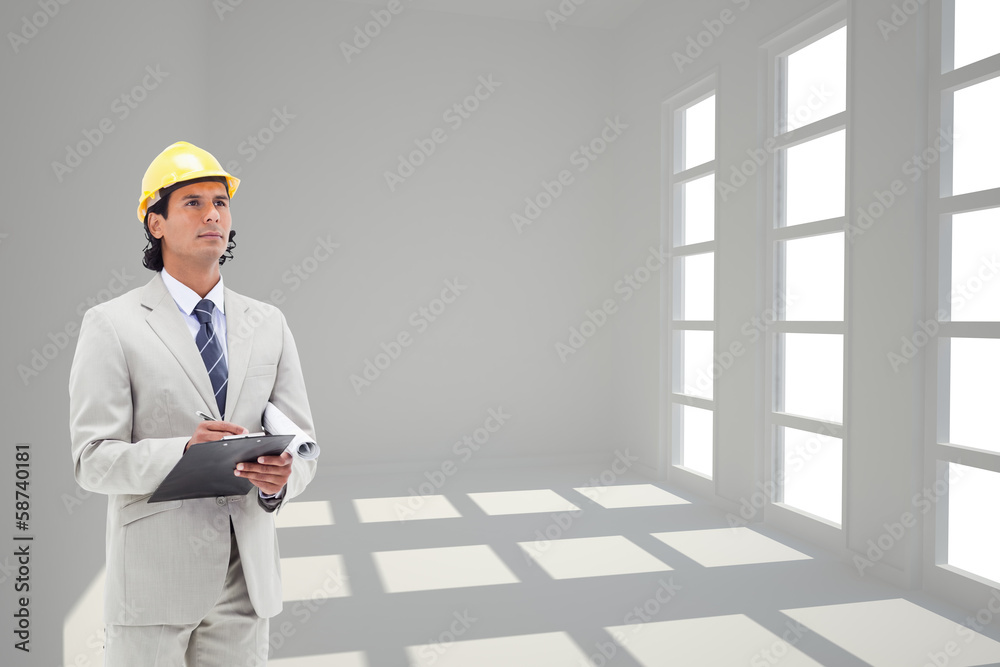 Aufkleber Composite image of architect taking notes