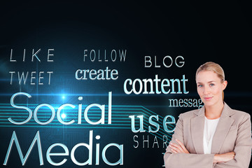 Composite image of confident female executive with folded arms