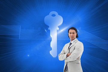 Composite image of serious office worker posing with the arms cr