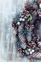 Rustic christmas wreath on wooden background