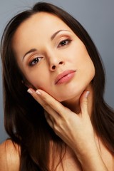 Obraz premium Beautiful young brunette woman with brown eyes 