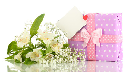 Giftbox and flowers isolated on white