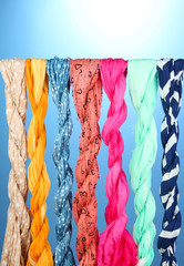 Colored scarves on blue background
