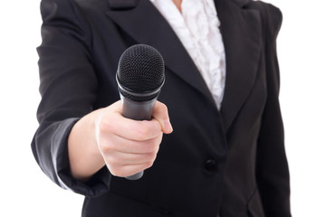 microphone in female reporter's hand over white