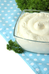 Sour cream in bowl close-up