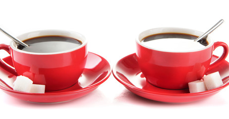 Red cups of strong coffee and sugar close up