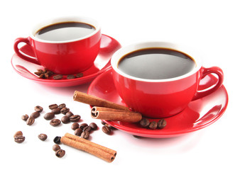 Red cups of strong coffee and coffee beans isolated on white