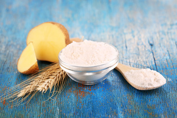 Starch in bowl on wooden table close-up