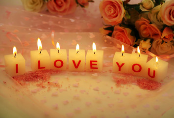 Candles with printed sign I LOVE YOU,on  color fabric