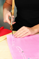 Cutting fabric with tailors scissors