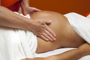 Fototapeta na wymiar Young pregnant woman receiving relaxing massage