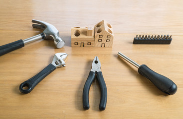 Set of tools and wood house toy.
