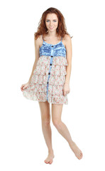 Beautiful young girl in dress isolated on white