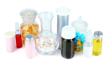 Medical bottles and pills isolated on white