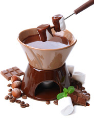 Chocolate fondue with marshmallow candies, isolated on white