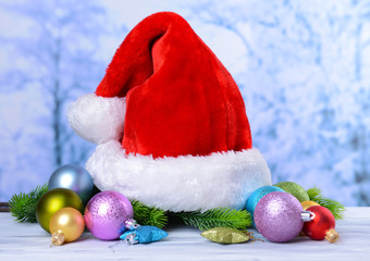 Composition with Santa Claus red hat and Christmas decorations