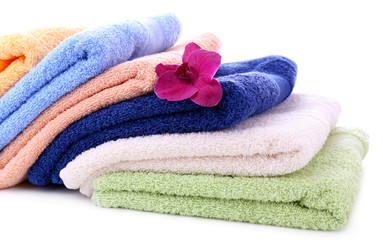 Orchid flower and towels, isolated on white