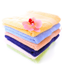 Orchid flower and towels, isolated on white
